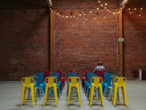 Brick wall with chairs in Ethics of Ownership